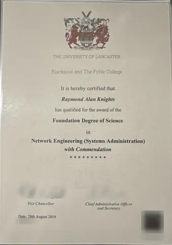 My Foundation Degree of Science certificate, with the certificate numbers, signatures and hologram blurred